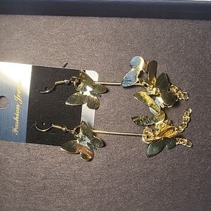 gold butterfly earrings.